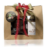 Immagine della borsa natalizia morgana del re contenente 1 crema spalmabile alla nocciola e un vasetto di nocciole pralinate